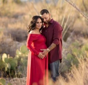 this is an image from Your Family's Journey, best doula in tucson of a pregnant woman and her partner
